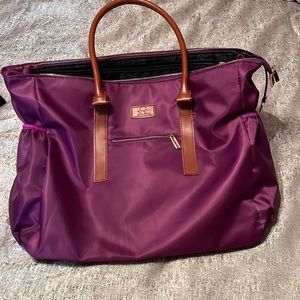 Teacher tote! A plum color and in good condition. There was a rip in the front